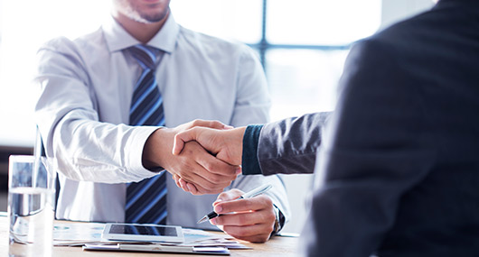 handshake between 2 executive man. Banking