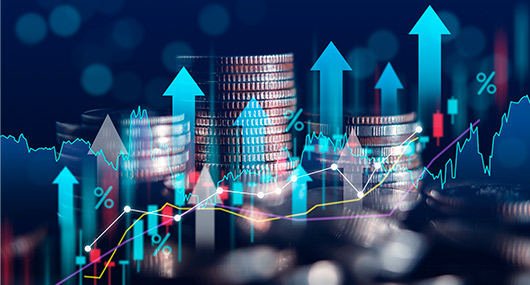 A person depositing cash into a bank machine outside a building, with a focus on the transaction process.